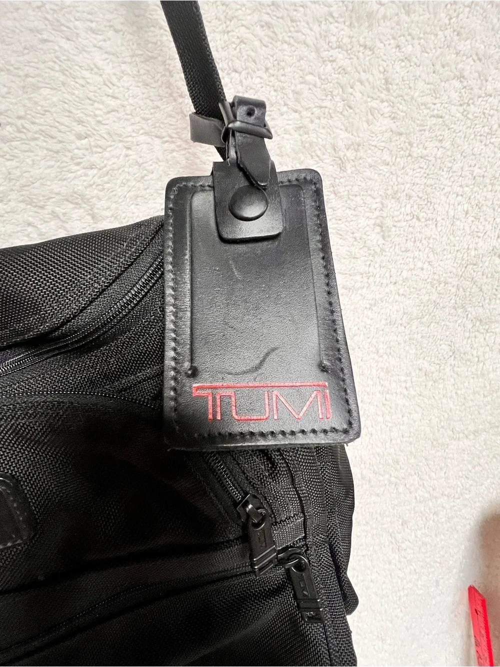 Tumi Black Nylon Messenger Bag with Red Logo Tag